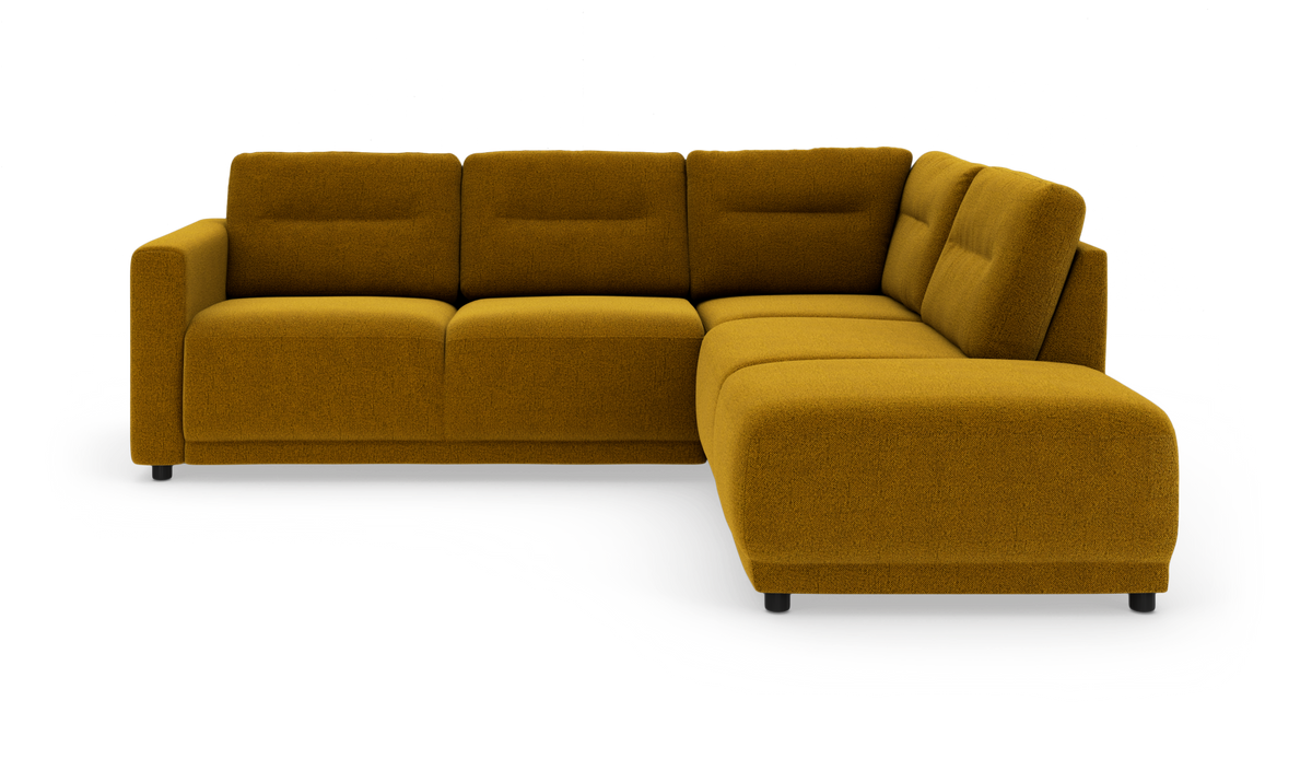 L‑formet modulsofa med højre chaiselong i sennepsgul tekstil, fritstående på hvid baggrund.