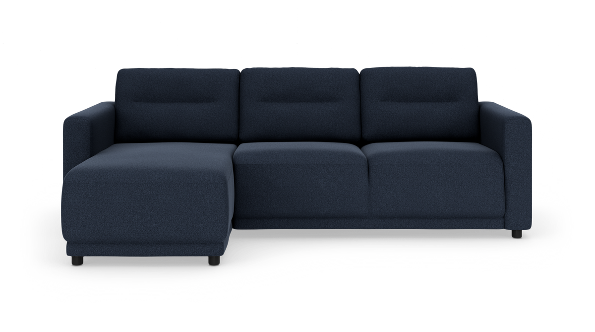 Mørkeblå modulsofa med venstrevendt chaiselong, set forfra på hvid baggrund.
