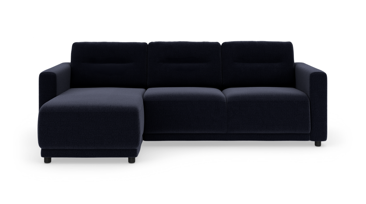 Mørkeblå modulsofa med venstrevendt chaiselong på hvid baggrund.
