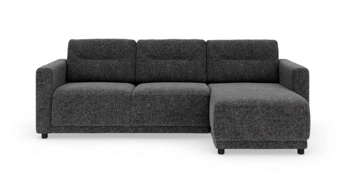 Mørkegrå modulsofa med chaiselong til højre, set forfra.