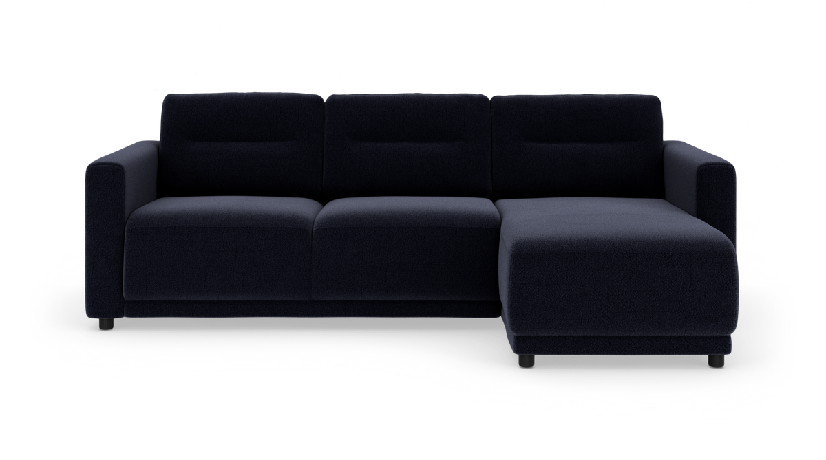 Mørkeblå modulsofa med højre chaiselong, set forfra mod hvid baggrund.