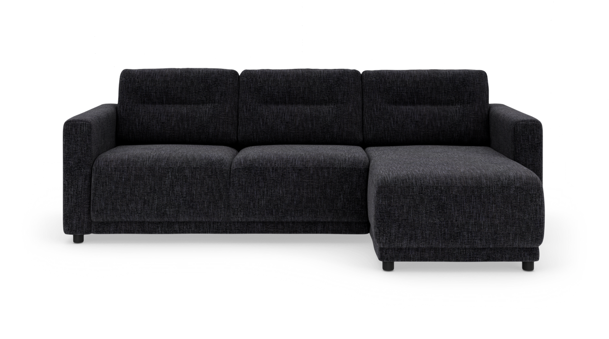 Mørkegrå hjørnesofa med chaiselong til højre, tre sæder og brede armlæn.