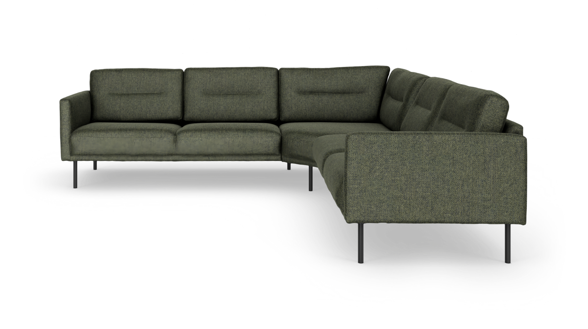 Grøn L-formet modulsofa med slanke metalben i studie på hvid baggrund.