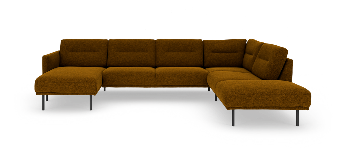 L‑formet modulsofa i sennepsgul bouclé med metalben på hvid baggrund.