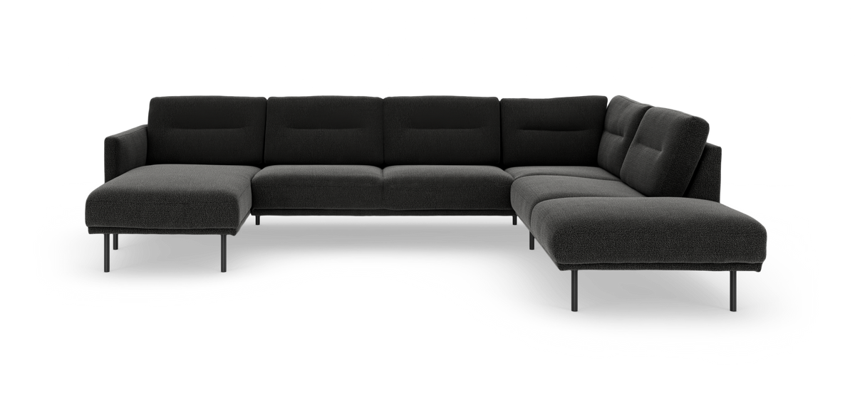 Mørkegrå modulsofa i U-form med chaiselong i begge ender og slanke metalben, frilagt på hvid baggrund.