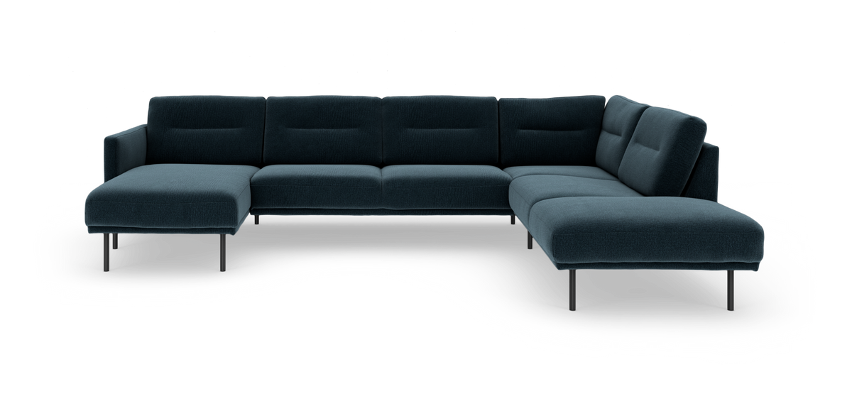Mørkeblå hjørnemodulsofa med chaiselong til venstre, fritstående på slanke metalben.