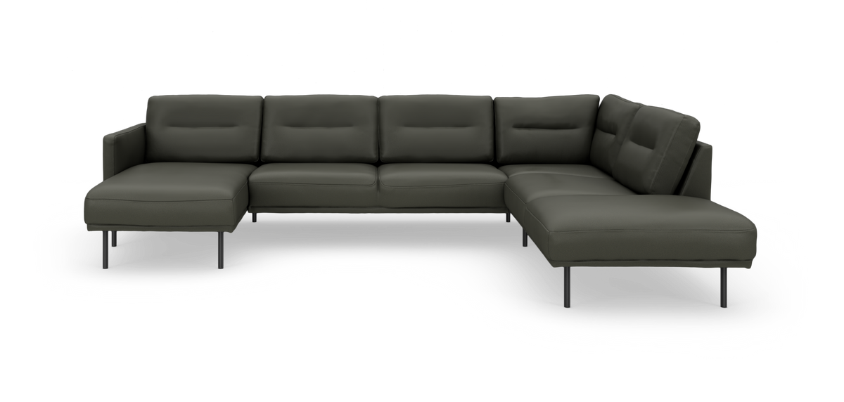 Mørkegrå modulsofa i hjørneopstilling med chaiselong, frilagt på hvid baggrund.
