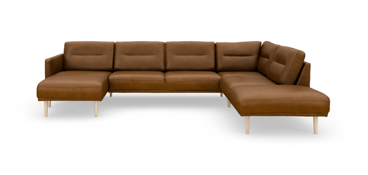 Brun modulsofa i læder med chaiselong, frilagt på hvid baggrund.