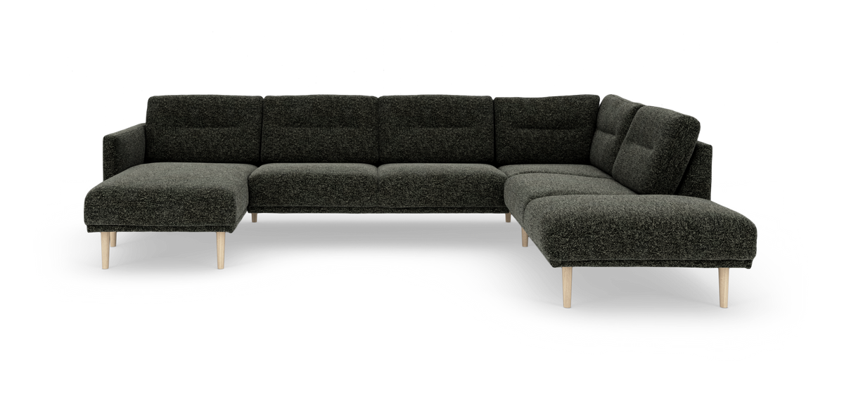 Mørkegrå U‑formet modulsofa med træben, frilagt på hvid baggrund.