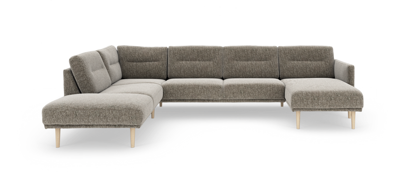 Modulær L-sofa i grå/beige stof med træben, vist som hjørnesofa med åben ende til venstre og chaiselong til højre._ps