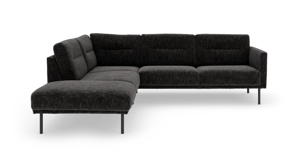 Mørkegrå L-formet modulsofa med metalben, frilagt på hvid baggrund.