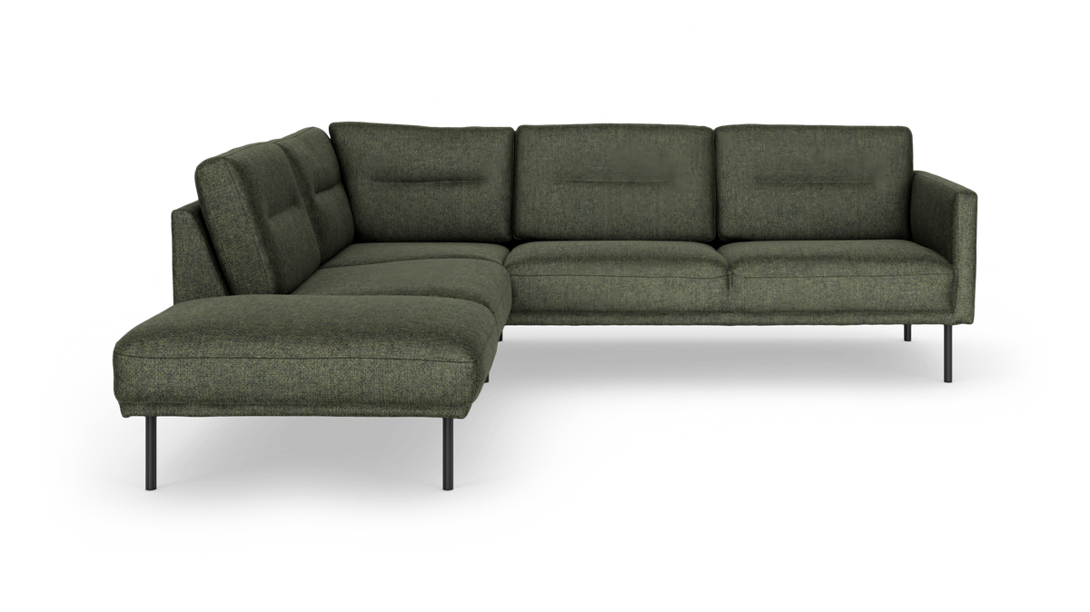 Grøn L-formet modulsofa med chaiselong til venstre på slanke metalben.