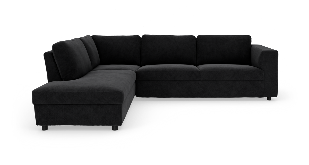 Sort hjørnesofa med chaiselong til venstre, frilagt på hvid baggrund.
