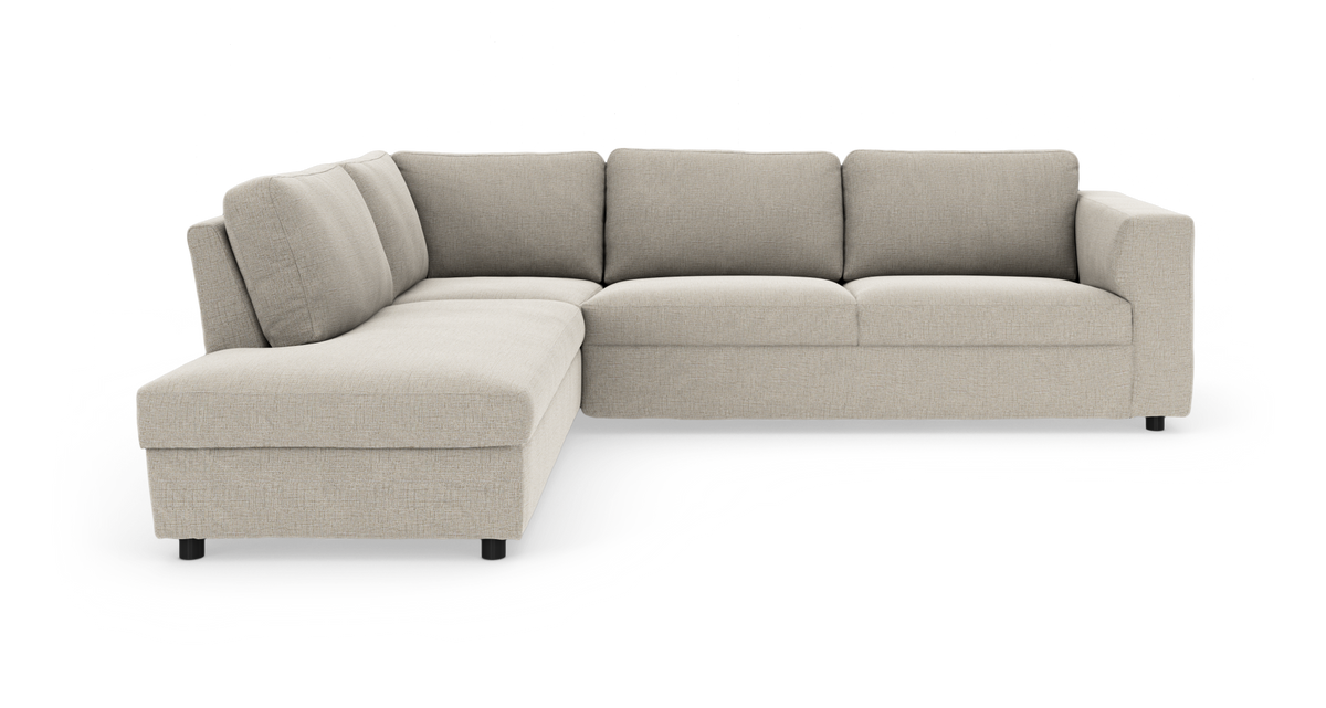 L-formet modulsofa med venstre chaiselong i lysebeige stof, fritlagt produktbillede.