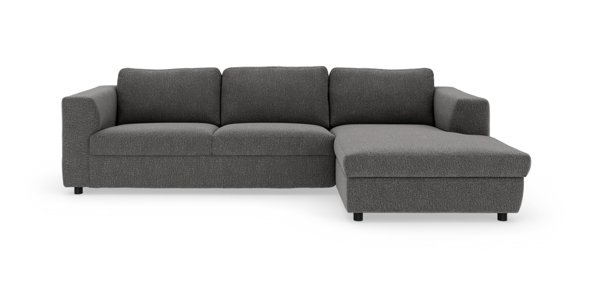 Mørkegrå hjørnesofa med chaiselong til højre, frilagt på hvid baggrund.