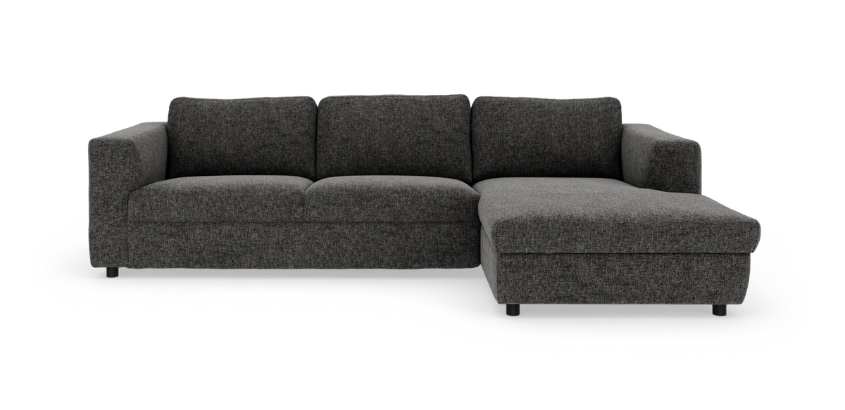 Mørkegrå hjørnesofa med chaiselong til højre i frontvisning på hvid baggrund.