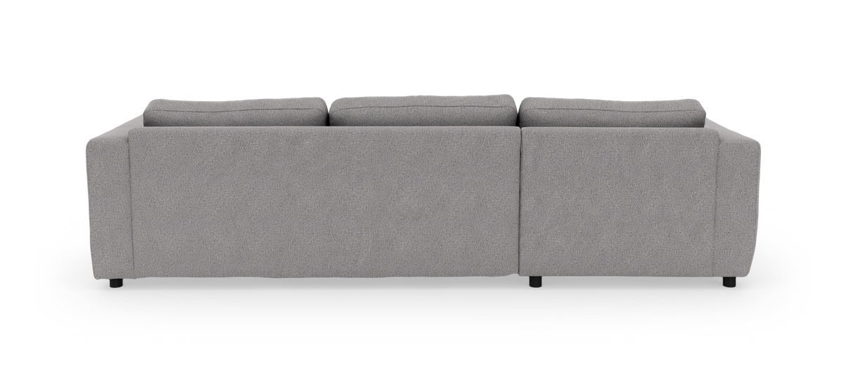 Grå modulsofa med tre rygpuder set bagfra, frilagt på hvid baggrund.