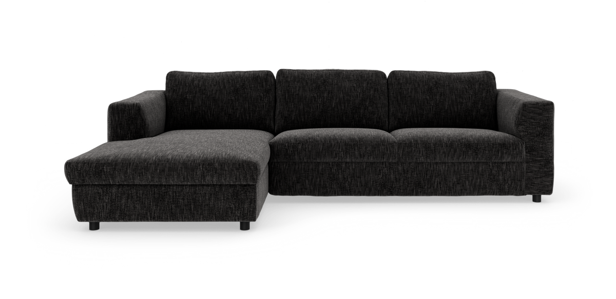 Mørkegrå L‑sofa med venstrevendt chaiselong på hvid/transparent baggrund.