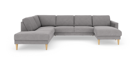 Grå modulopbygget hjørnesofa med chaiselong til højre og lyse træben, fritlagt mod hvid baggrund.