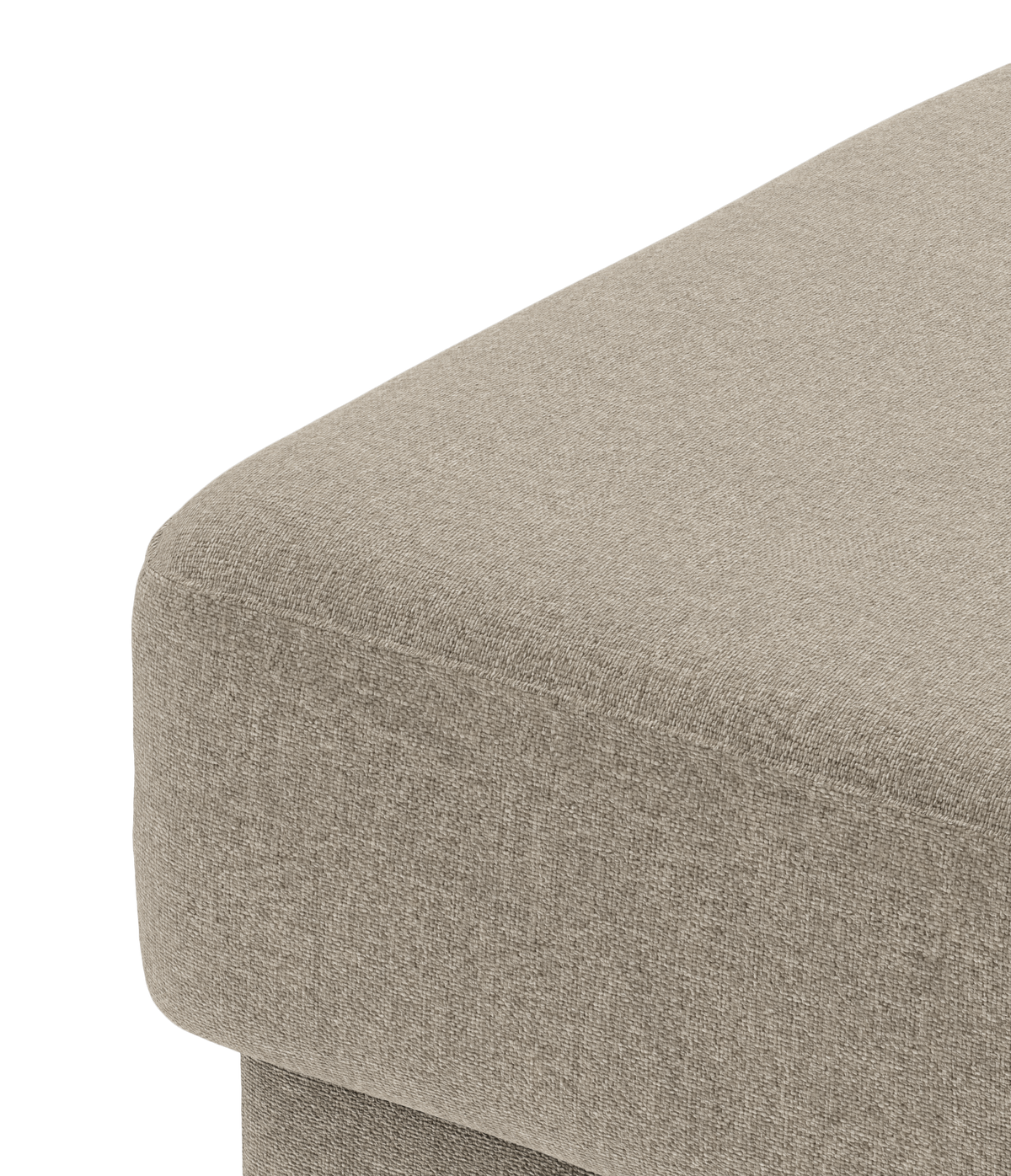 Nærbillede af beige stofbetrukket hjørne af sofa eller puf i studieopsætning.