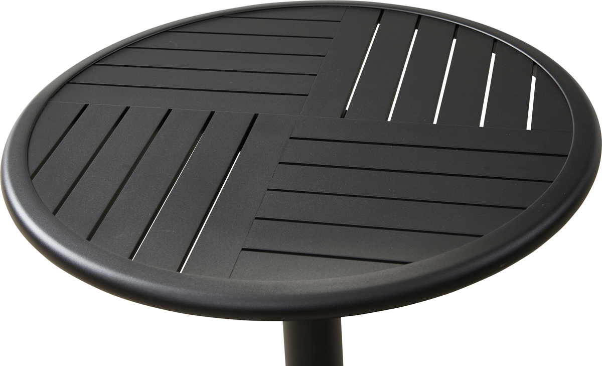 Rund sort bordplade med rillet kvadrantopdelt design.