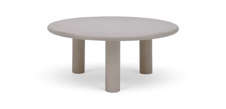 Rundt beige sofabord med tre cylindriske ben.