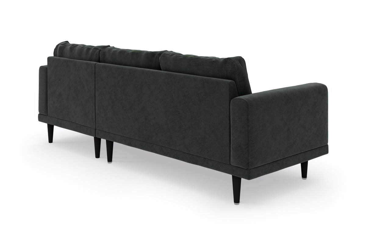 Mørkegrøn sofa med afrundede armlæn og sorte ben, set bagfra i vinkel på hvid baggrund.