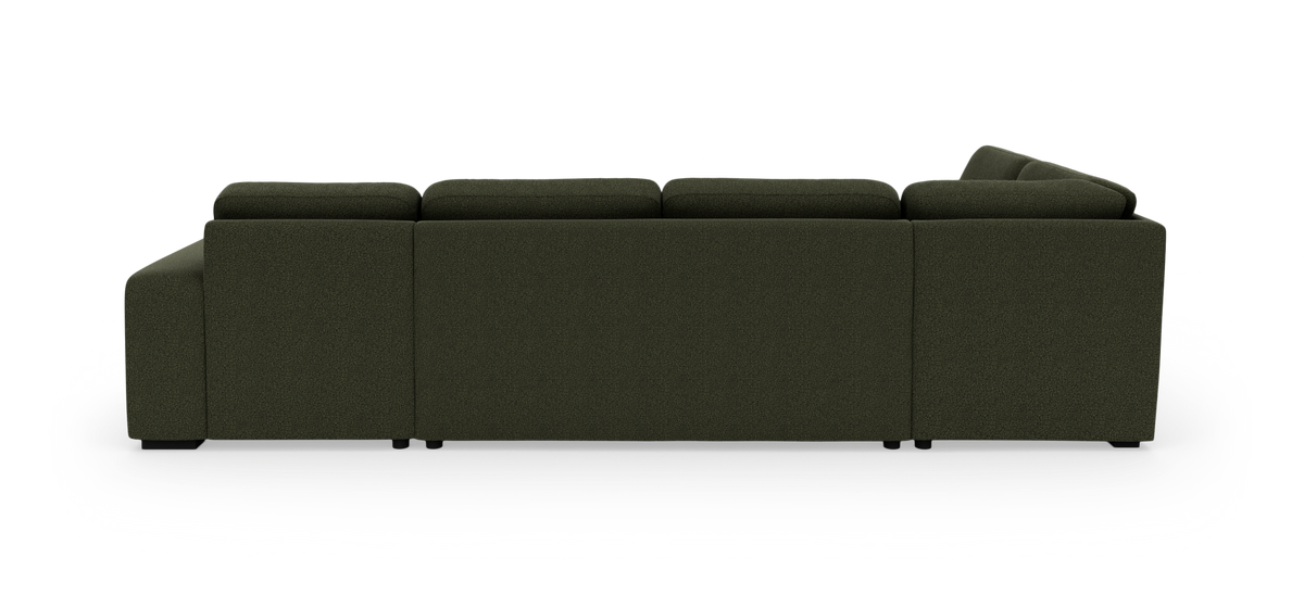 Mørkegrøn modulsofa set fra siden/bagsiden på hvid baggrund.