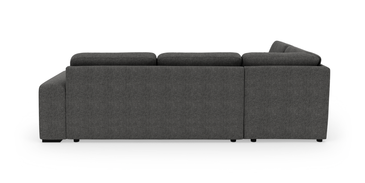 Mørkegrå modulsofa set bagfra på hvid baggrund.