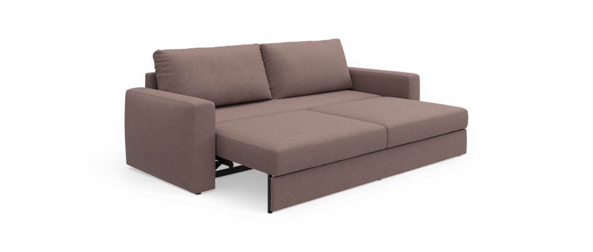 Brun sovesofa i stof i udtrukket sengestilling med to ryghynder.