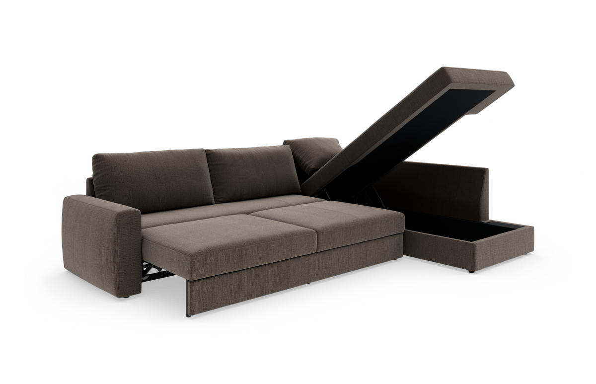 Brun sovesofa med chaiselong i studiemiljø, med åbent opbevaringsrum i chaiselongen.