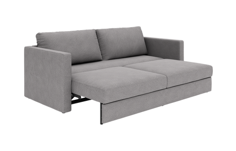 Grå 2-personers sovesofa i stof, vist i udfoldet position i studieopsætning.