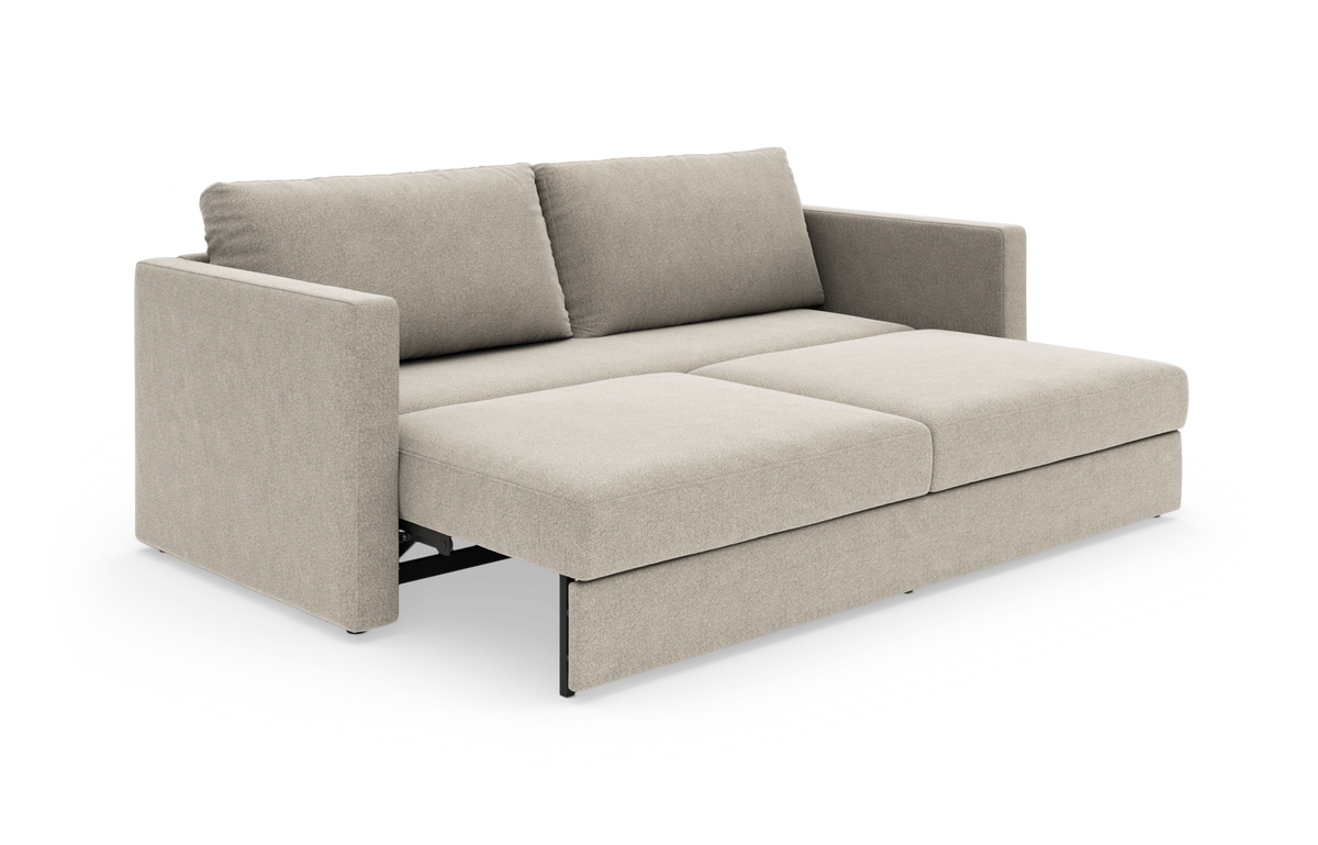 Beige sovesofa i moderne, minimalistisk stil i udslået position.