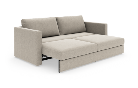 Beige sovesofa i moderne, minimalistisk stil i udslået position.