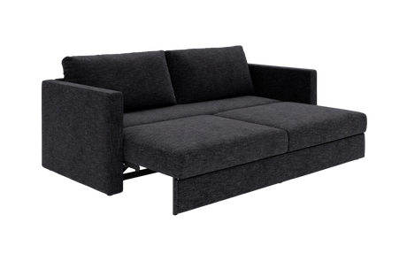 Mørkegrå stof-sovesofa trukket ud til seng med lige armlæn og to ryghynder.