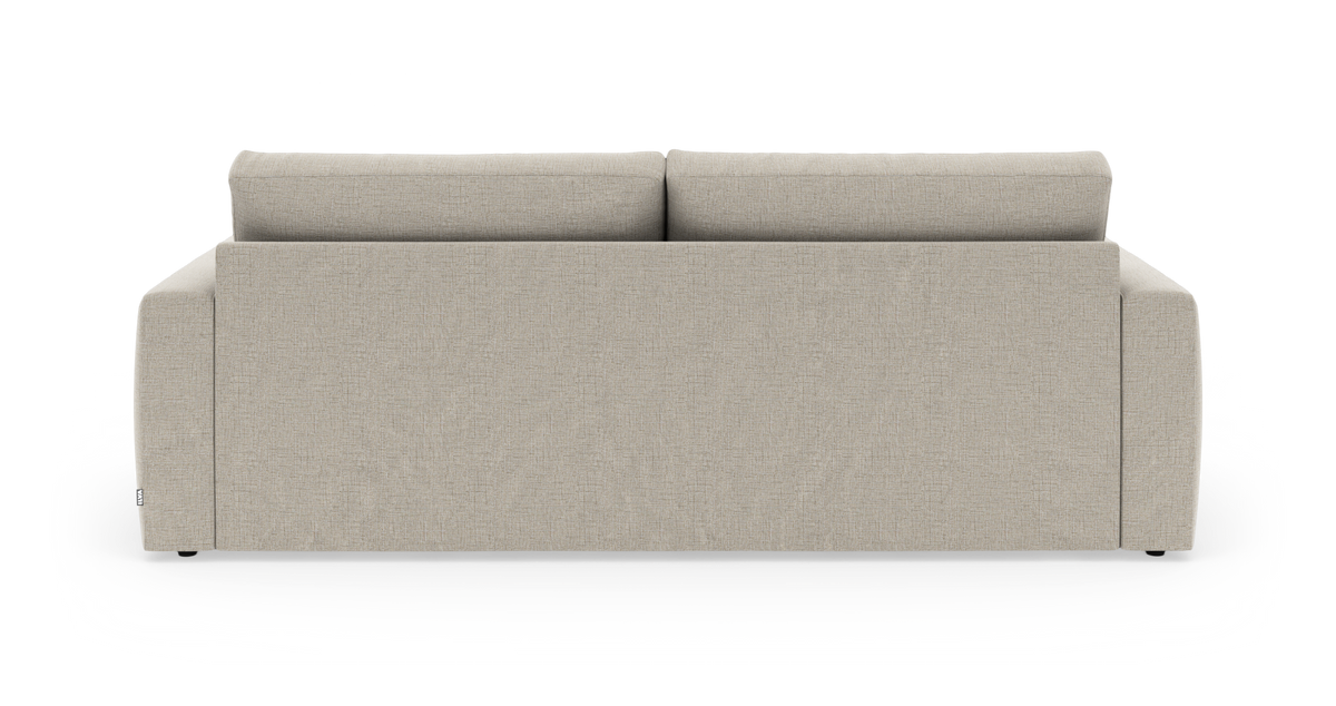 Beigefarvet sofa set bagfra på hvid studiebaggrund.