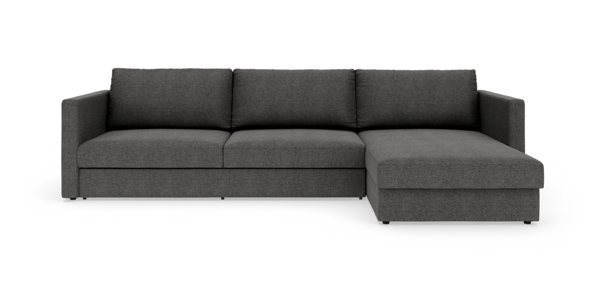 Mørkegrå hjørnesofa med chaiselong til højre, frilagt mod hvid baggrund.