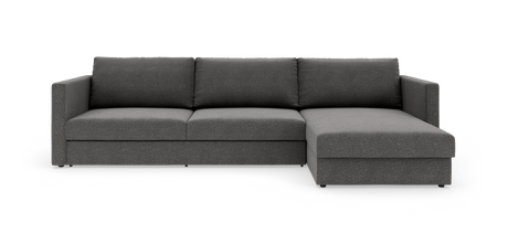 Mørkegrå modulsofa med chaiselong på højre side, set forfra i studio.