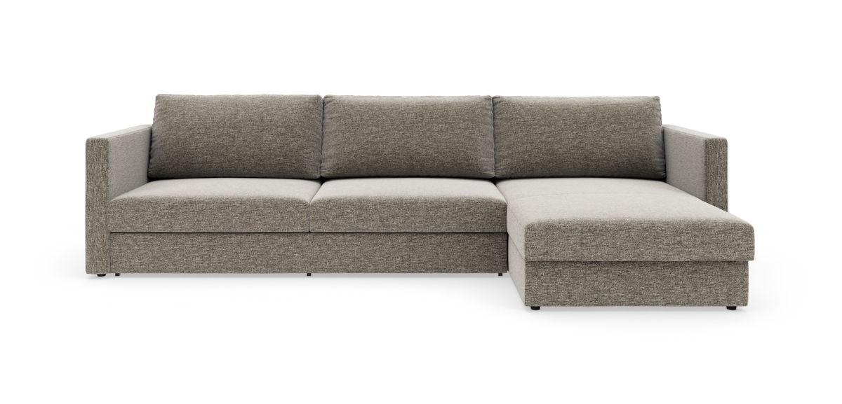 Modulsofa i grå‑beige stof med højre chaiselong, frilagt på hvid baggrund.