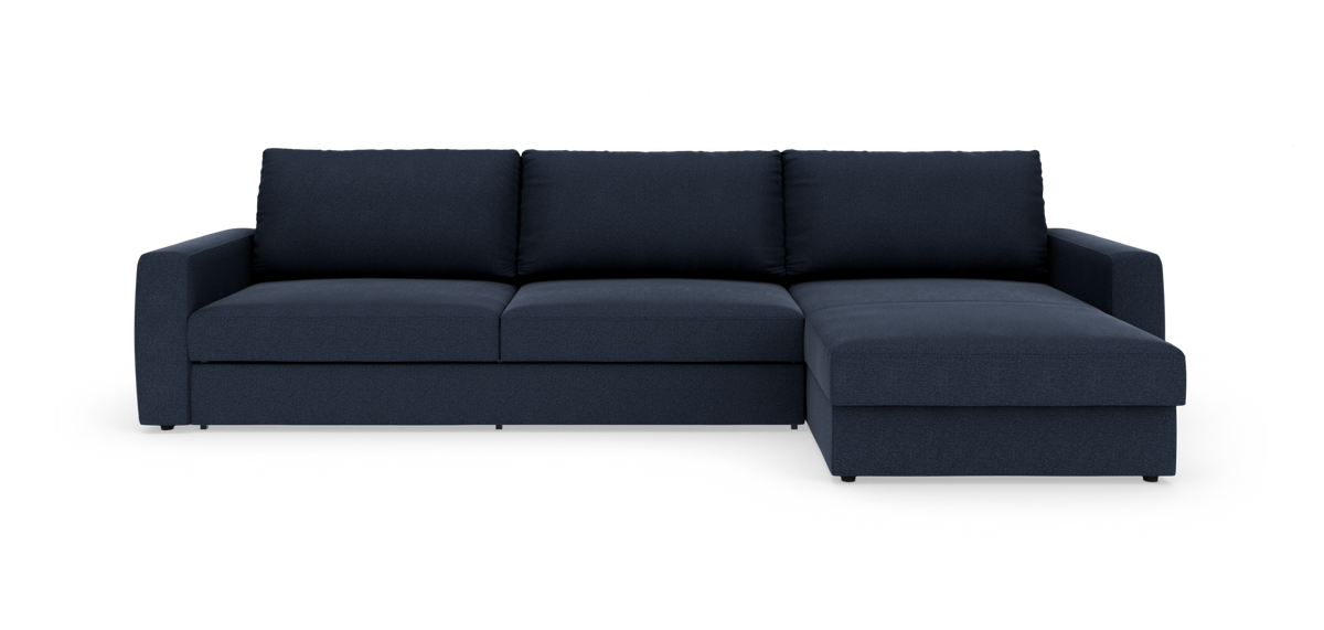 Mørkeblå modulsofa med chaiselong til højre, frontvisning på hvid baggrund.