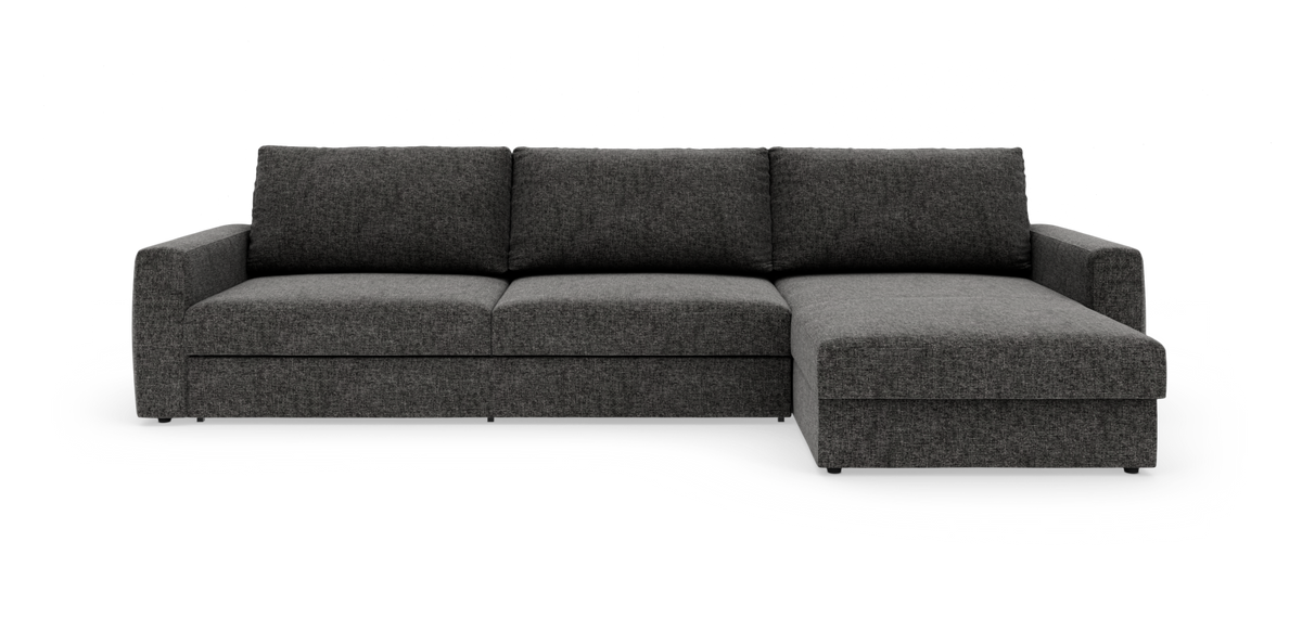 Mørkegrå hjørnesofa med chaiselong til højre på hvid studiobaggrund.