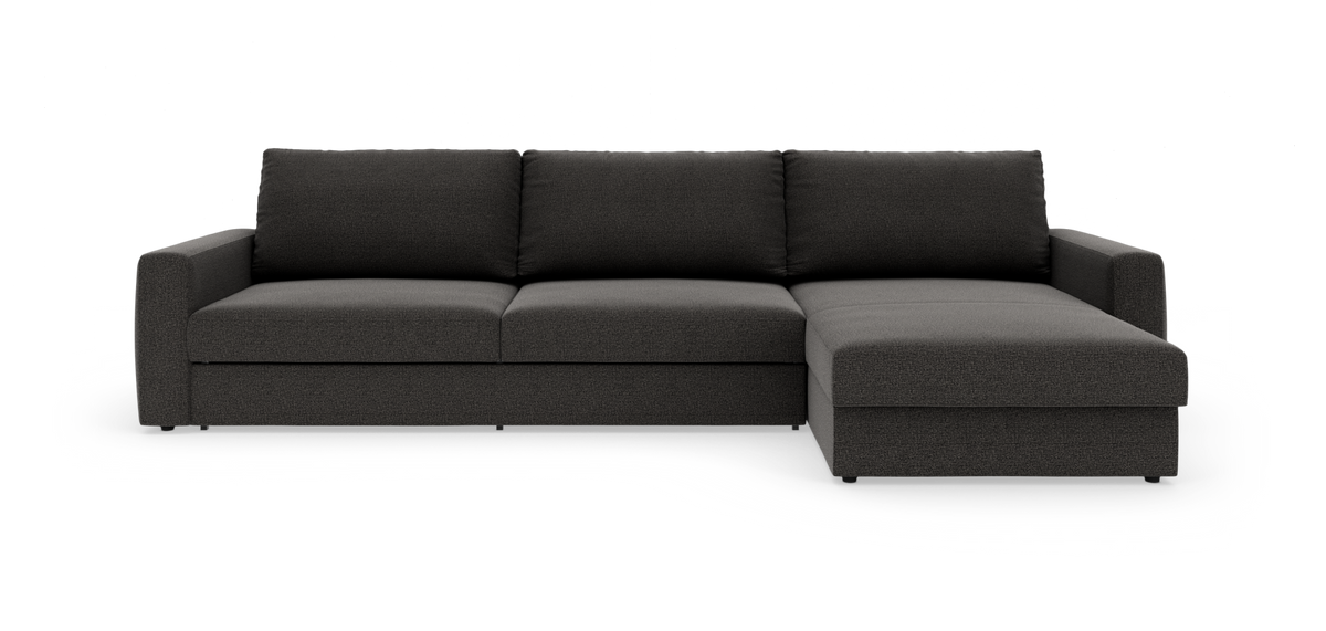 Mørkegrå modulsofa med højre chaiselong, set forfra i studieopstilling.