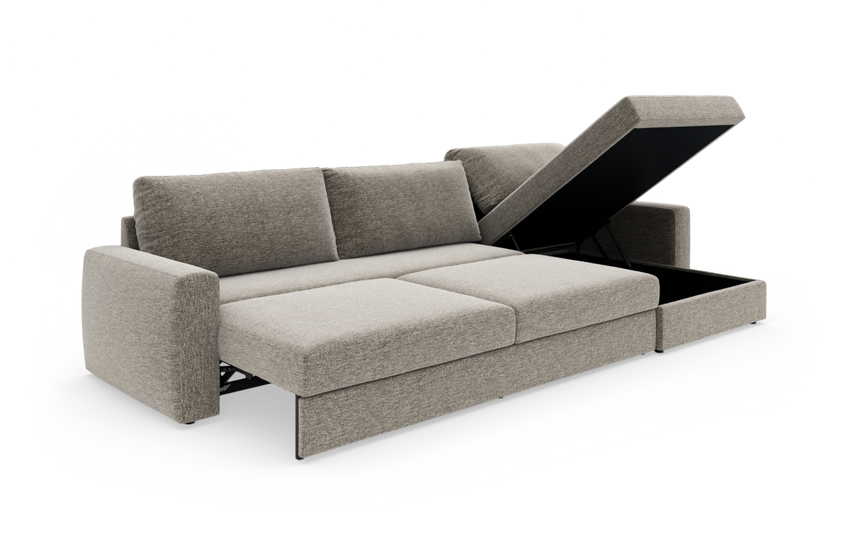Beige/grå hjørnesofa med sovefunktion og løftbar chaiselong med opbevaring, frilagt i studiemiljø.