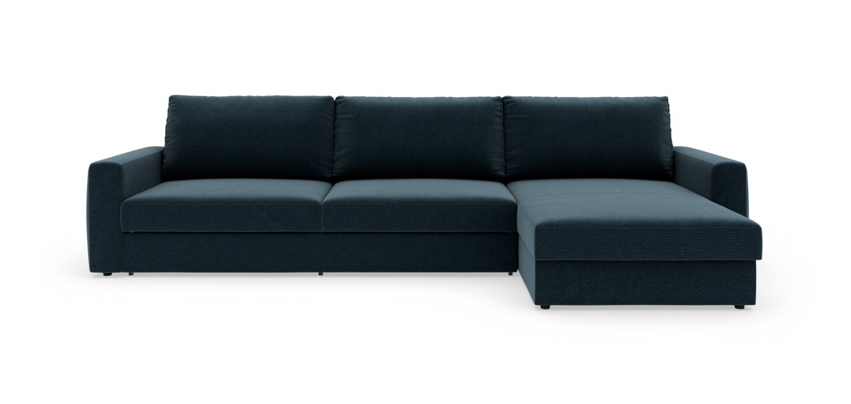 Mørk teal hjørnesofa med højrevendt chaiselong, tre ryghynder og brede armlæn i studieopsætning.