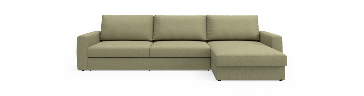 Grøn hjørnesofa med chaiselong til højre, frilagt på sort baggrund.