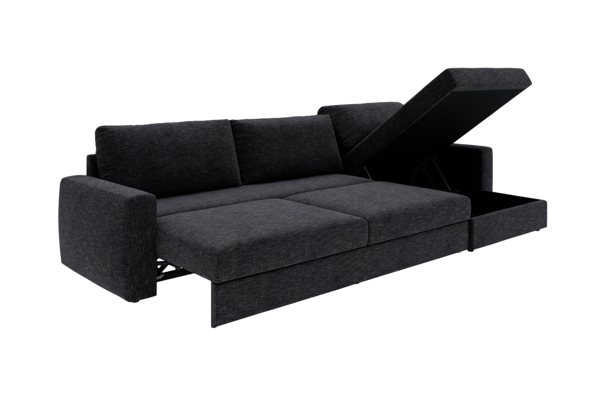 Mørkegrå sovesofa med åben chaiselong og opbevaring, set skråt forfra på hvid baggrund.