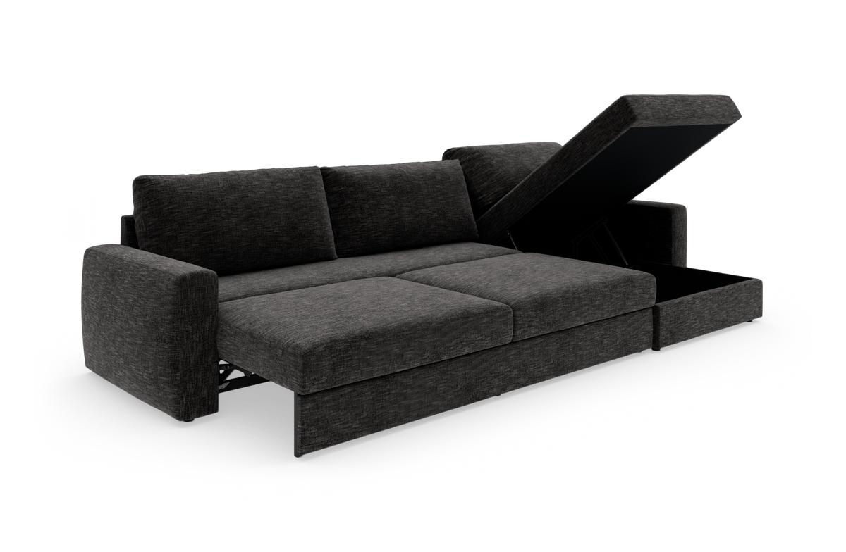 Mørkegrå sovesofa med chaiselong og opklappeligt opbevaringsrum på hvid studiobaggrund.