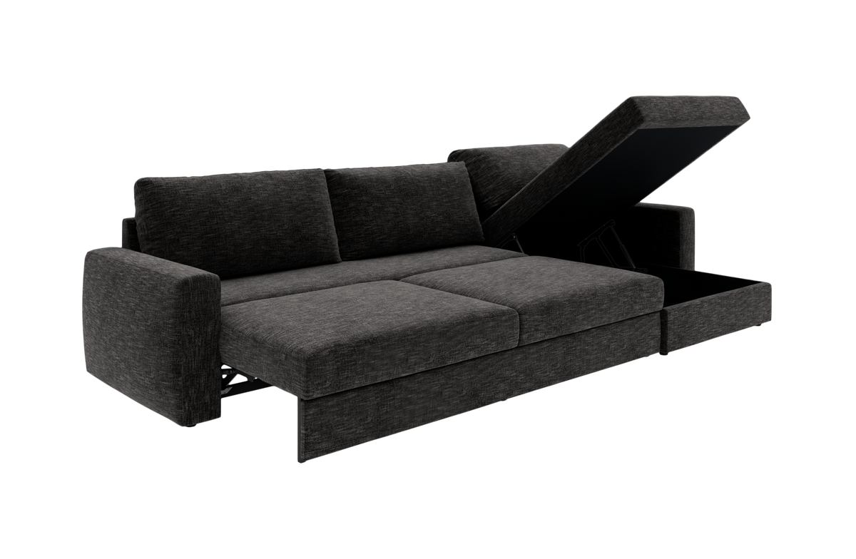 Mørkegrå sovesofa med løftbar chaiselong og opbevaringsrum, fotograferet i vinkel.