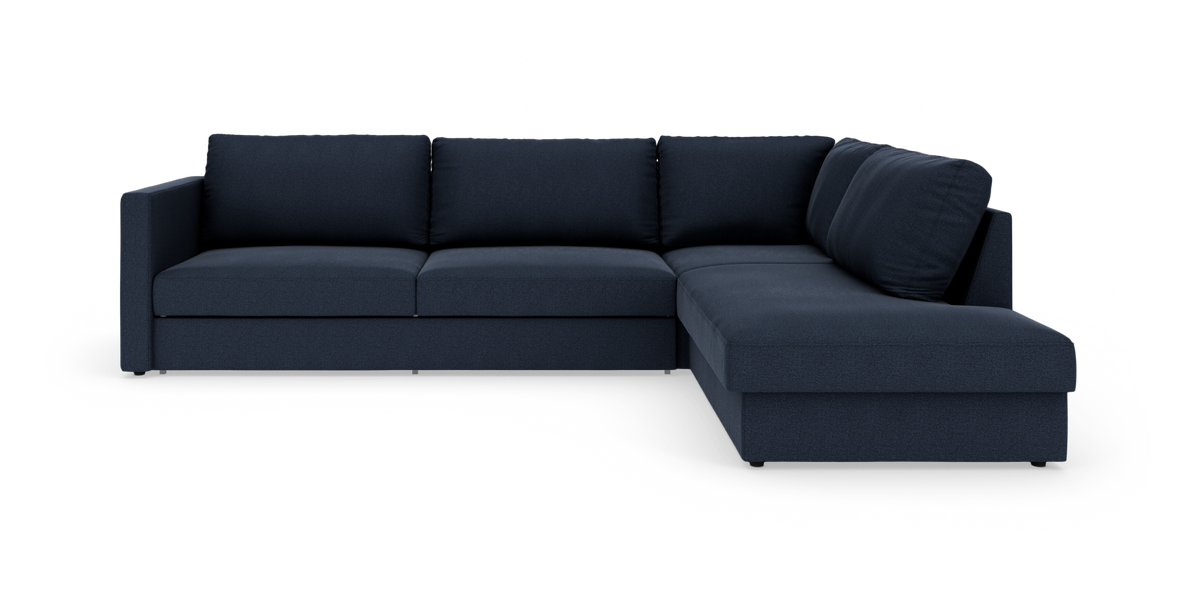 Mørkeblå L-formet modulsofa med chaiselong til højre, frilagt på hvid baggrund.