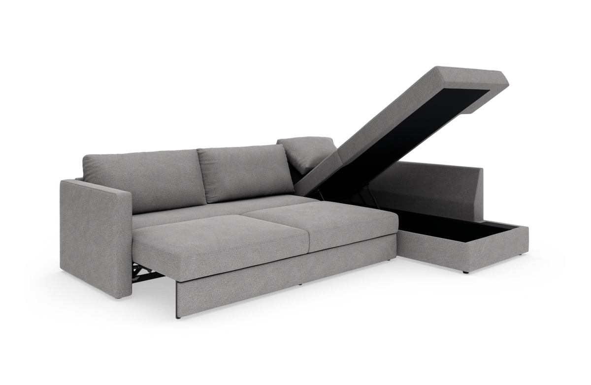 Grå hjørnesofa med chaiselong og opklappelig opbevaring, frilagt på hvid baggrund.